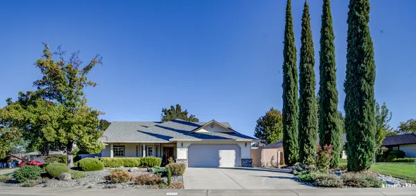 a front view of a house with a yard