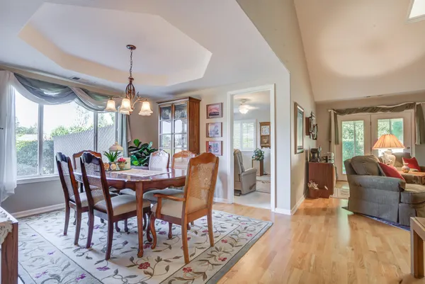 a view of a dining room with furniture window and wooden floor