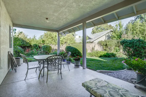 a garden view with a sitting space