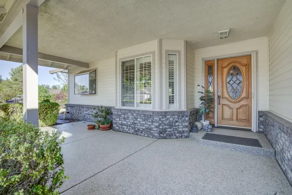 a front view of a house with garden
