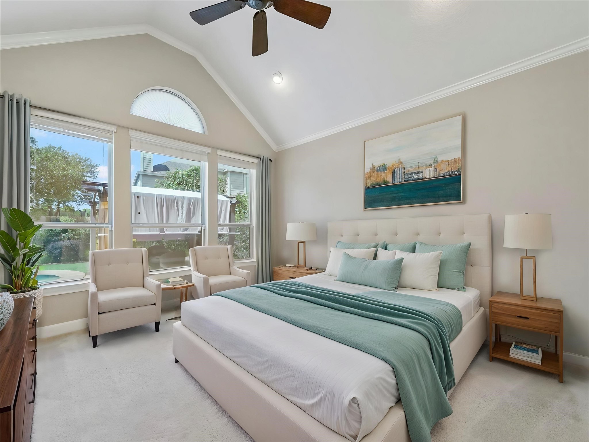 9915 Rochs Hill Court Katy, TX 77494 - Photo 11 of 32 a bedroom with a large bed and a chandelier