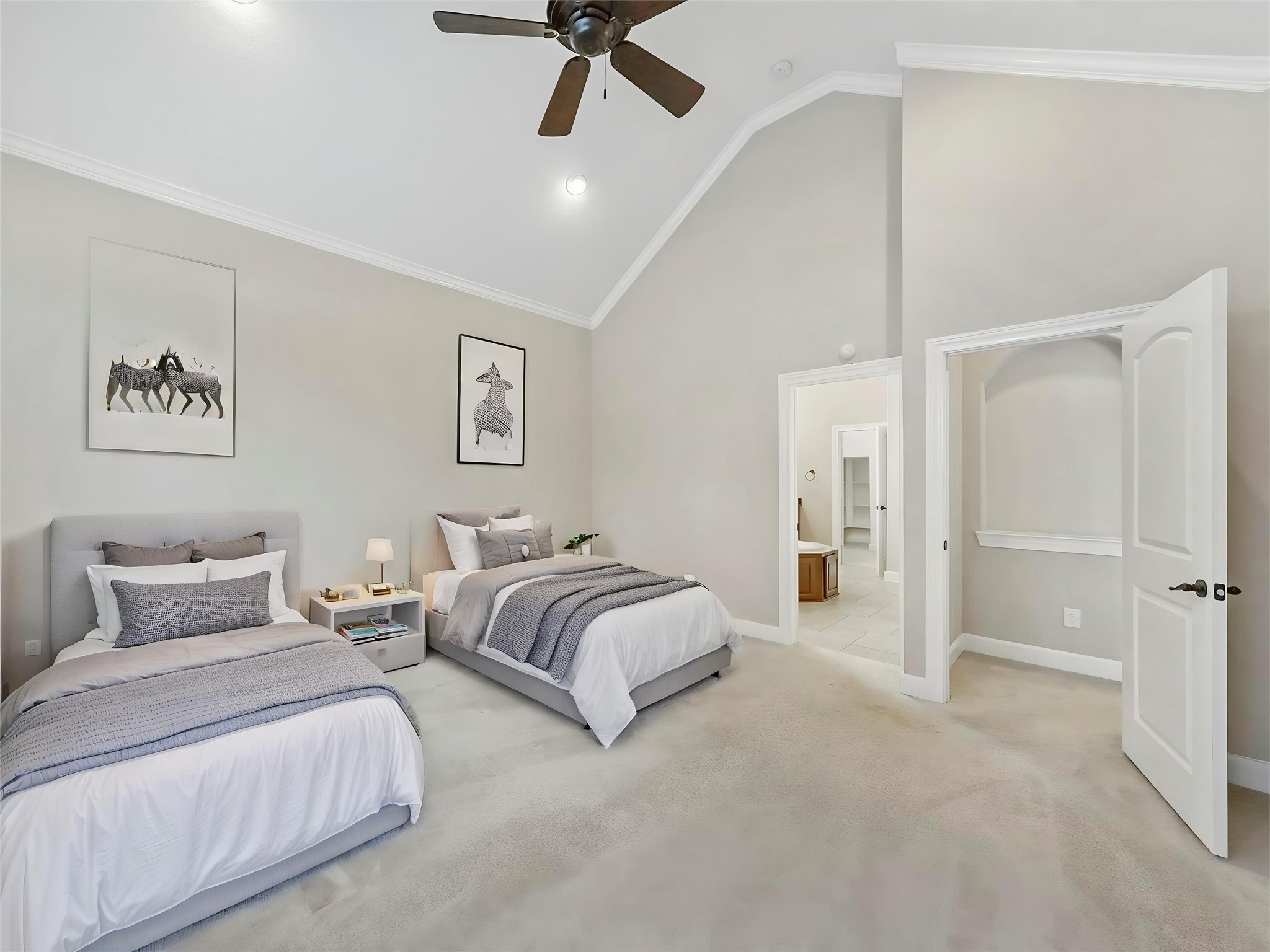 9915 Rochs Hill Court Katy, TX 77494 - Photo 16 of 32 a spacious bedroom with two beds and painted walls