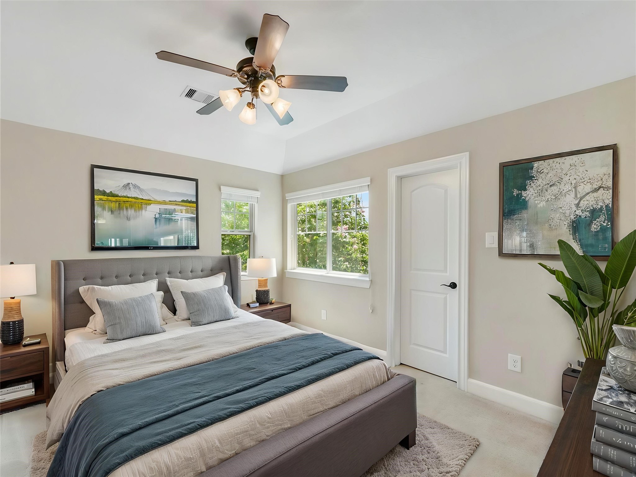 9915 Rochs Hill Court Katy, TX 77494 - Photo 18 of 32 a bedroom with a large bed and a chandelier