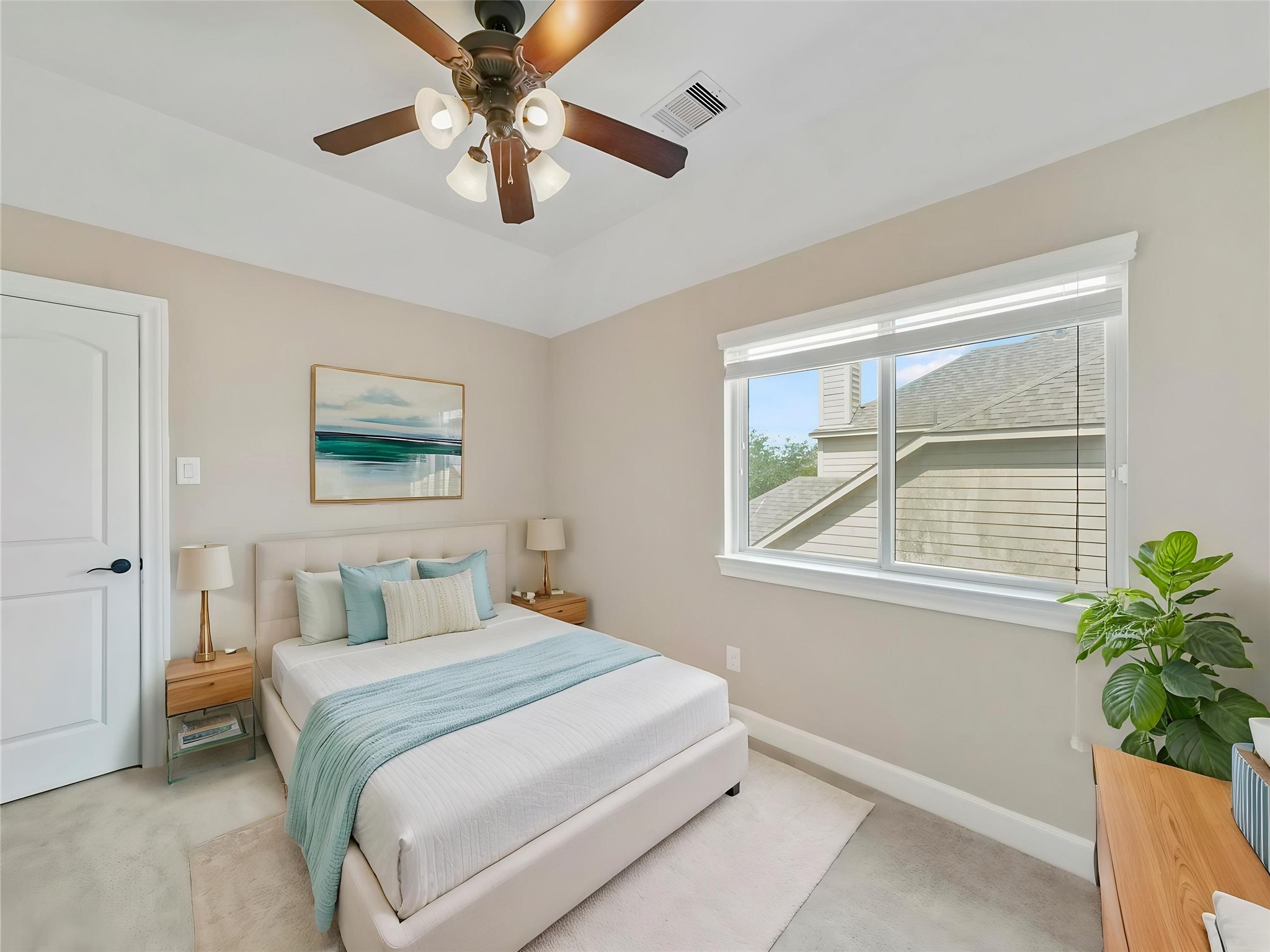 9915 Rochs Hill Court Katy, TX 77494 - Photo 21 of 32 a bedroom with a bed and a potted plant