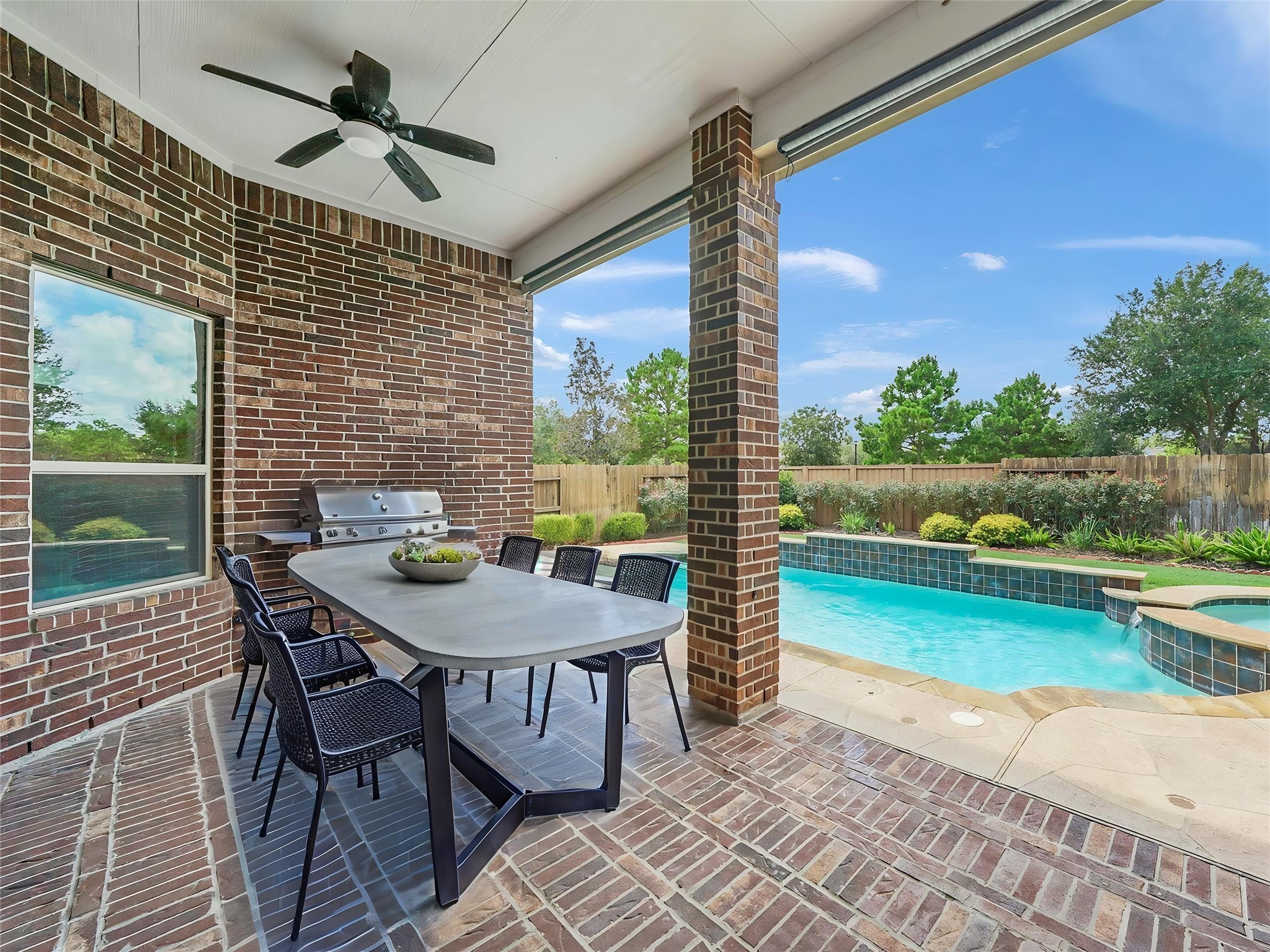 9915 Rochs Hill Court Katy, TX 77494 - Photo 24 of 32 a view of a patio with a table chairs and a table