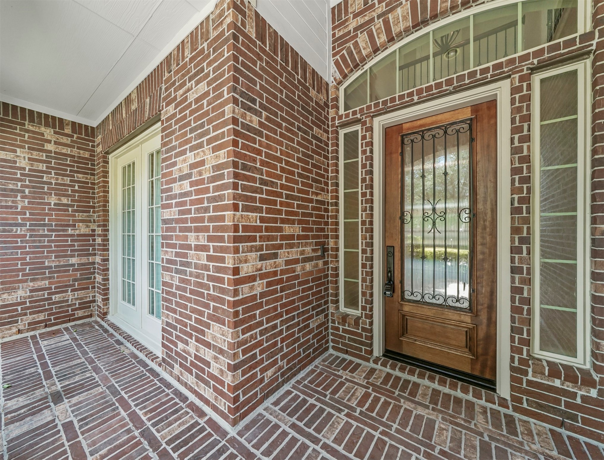 9915 Rochs Hill Court Katy, TX 77494 - Photo 3 of 32 a view of a brick house with many windows