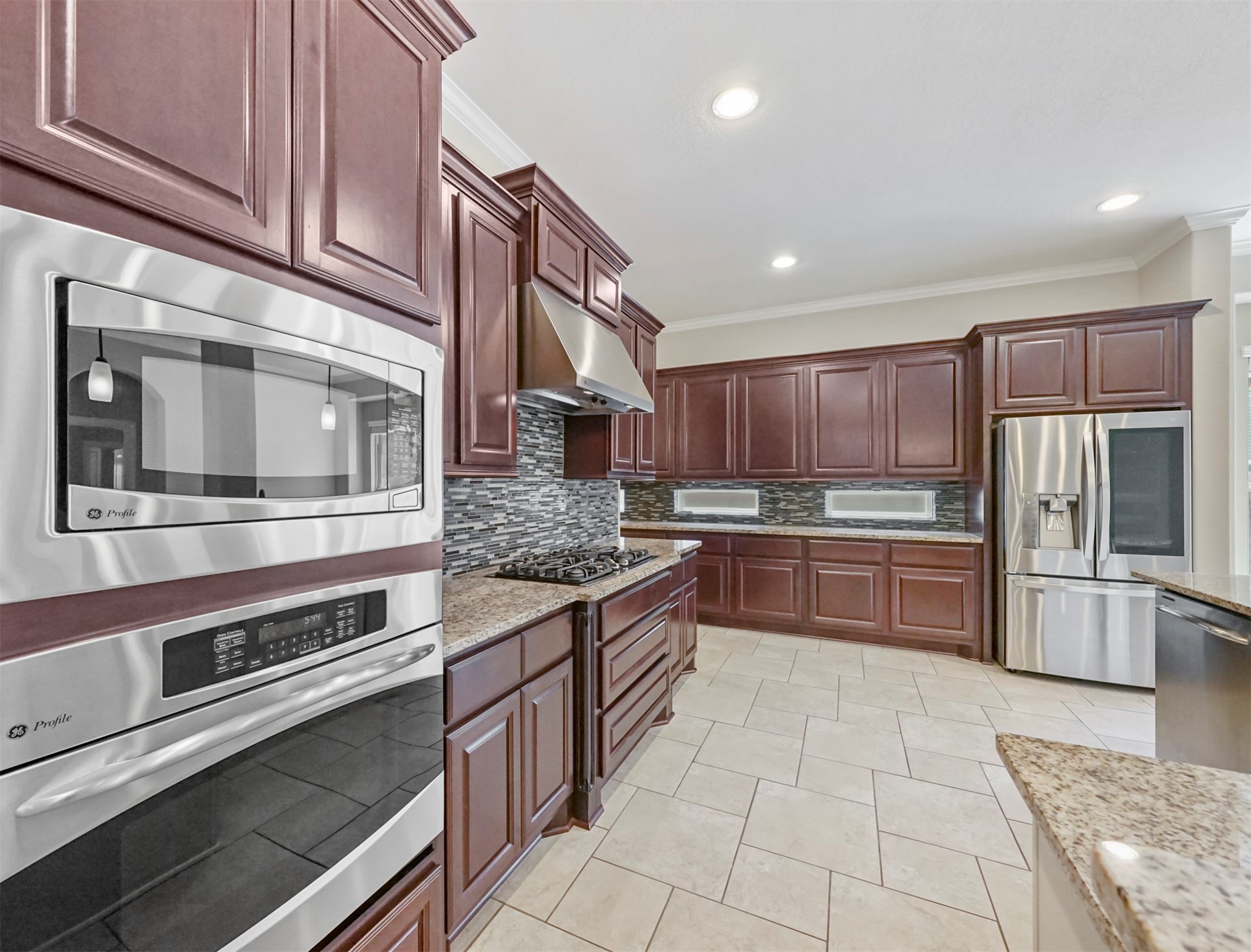 9915 Rochs Hill Court Katy, TX 77494 - Photo 8 of 32 a kitchen with stainless steel appliances granite countertop a stove and a sink