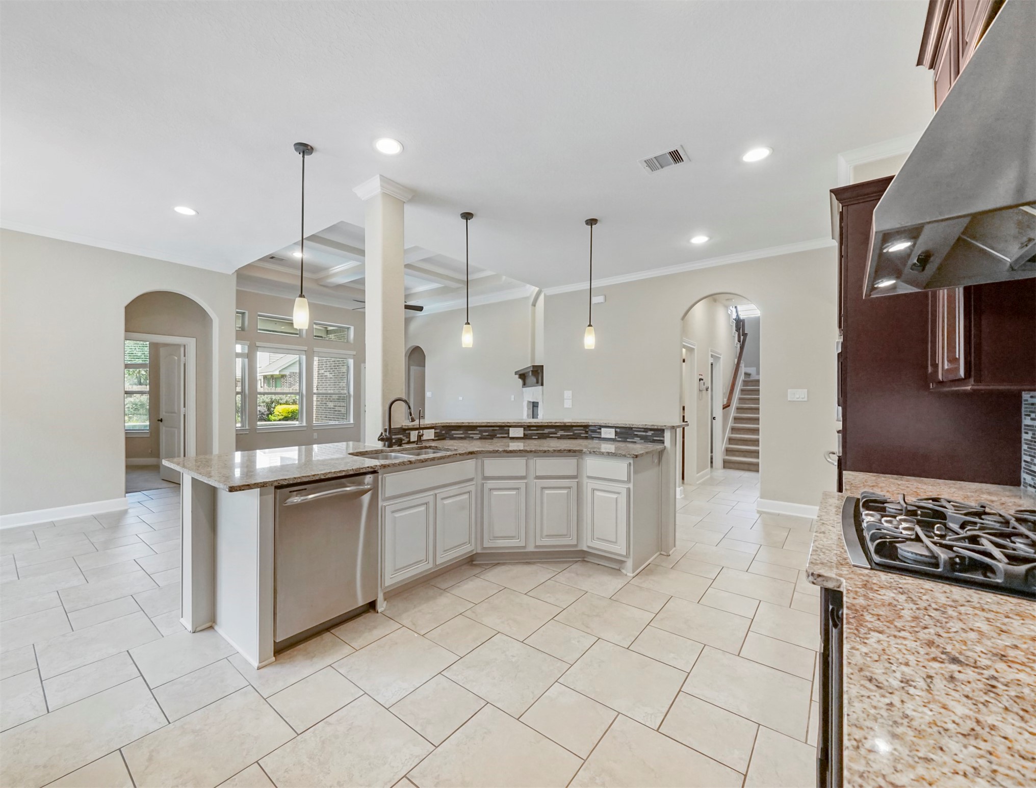 9915 Rochs Hill Court Katy, TX 77494 - Photo 9 of 32 a large kitchen with stainless steel appliances kitchen island granite countertop a sink and cabinets