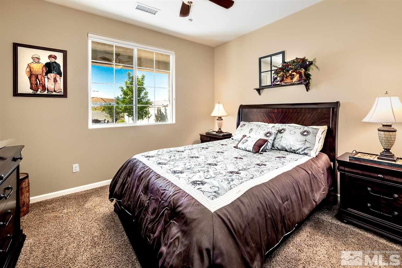 2260 Makenna Drive Reno, NV 89521 - Photo 20 of 27 a bedroom with bed and painting on the wall