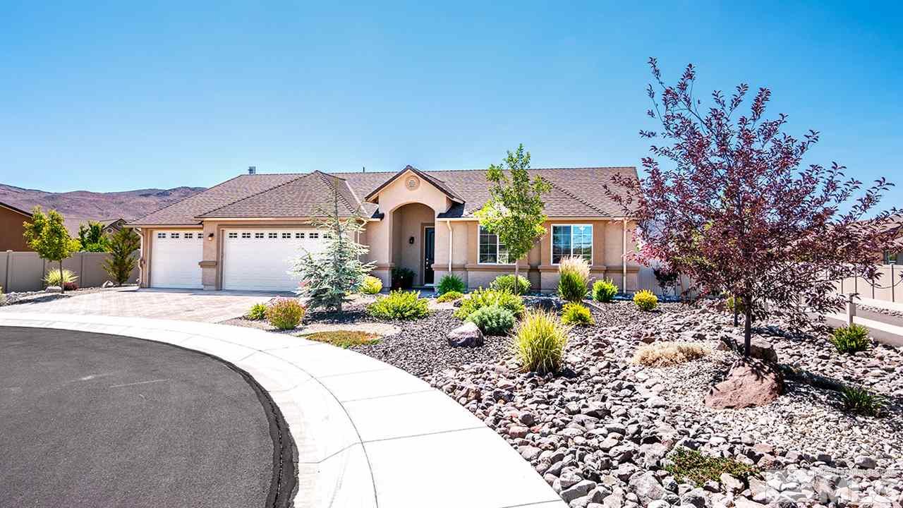 2260 Makenna Drive Reno, NV 89521 - Photo 24 of 27 a front view of a house with a garden