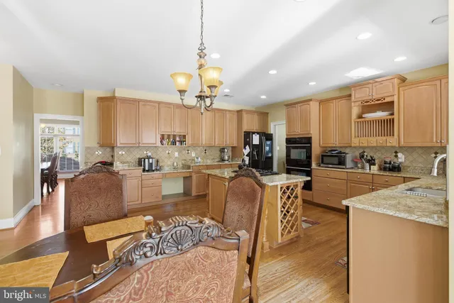 a large kitchen with granite countertop lots of counter top space