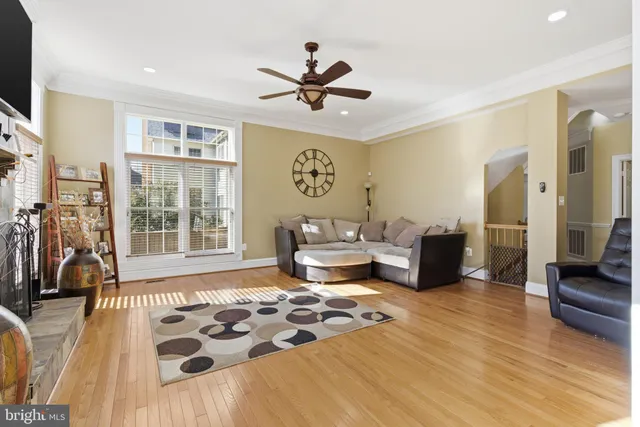 a bedroom with furniture and a large window