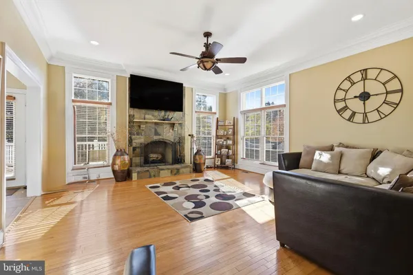 a living room with fireplace furniture and a flat screen tv