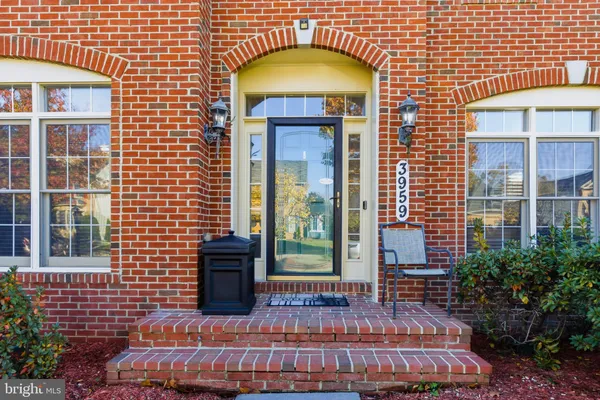 a view of a brick house with a large window