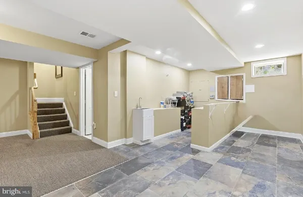 a view of a kitchen with wooden floor and entryway