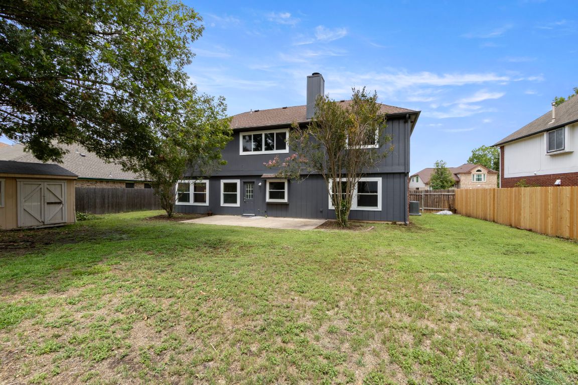 410 Steeplechase Drive Georgetown, TX 78626 - Photo 15 of 15 a front view of a house with a garden