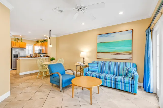 a dining room with furniture and a chandelier