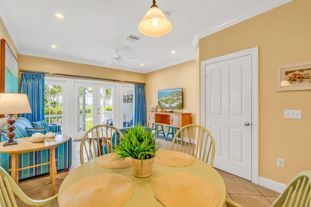 a kitchen with stainless steel appliances kitchen island granite countertop a refrigerator sink and cabinets