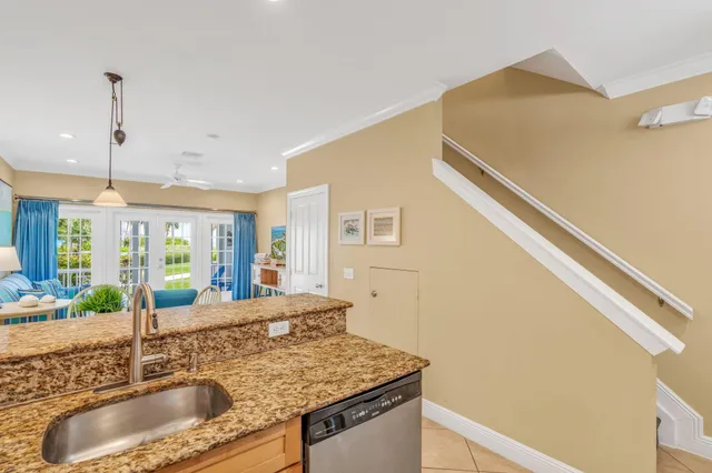 a kitchen with a stove a sink and a refrigerator