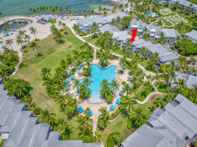 a view of backyard with swimming pool and green space