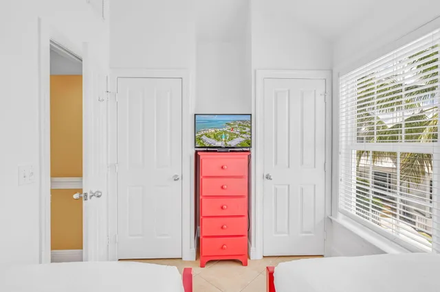 an aerial view of a house with a yard and garden