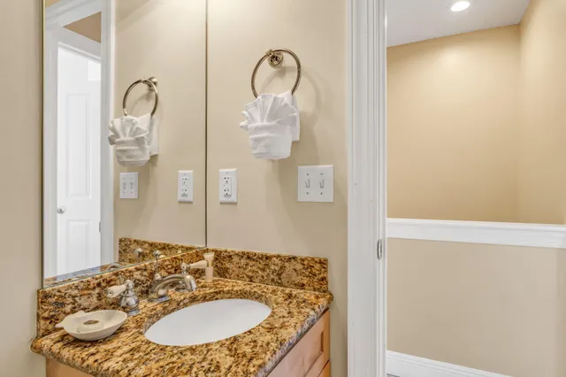 a view of living room filled with furniture and wooden floor