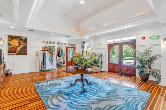 a view of a patio with a table and chairs