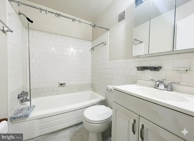 a bathroom with a sink a toilet and a bathtub