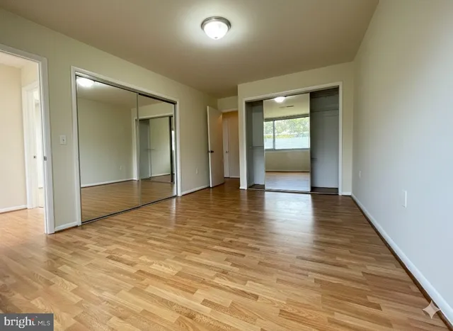 wooden floor in a hall with an empty room