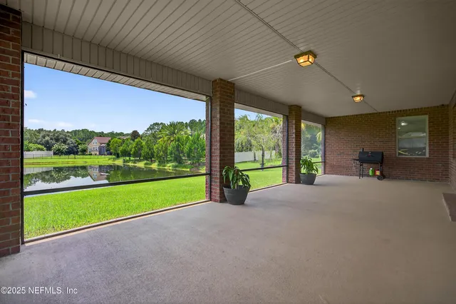 a view of a room with furniture and a garden