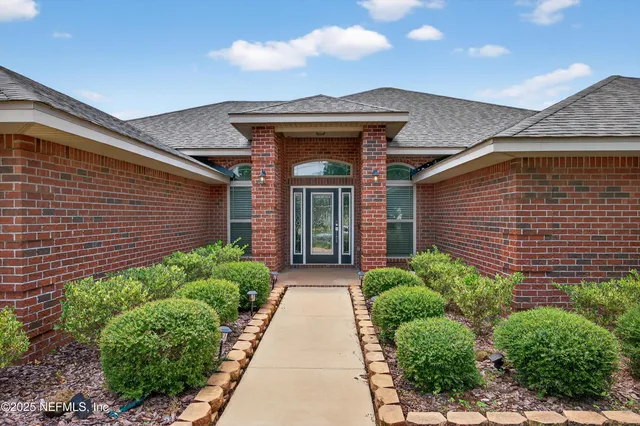 a view of a pathway along the house