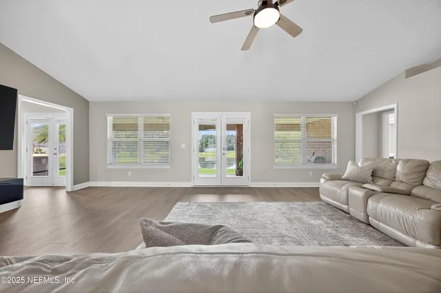 a living room with furniture and windows