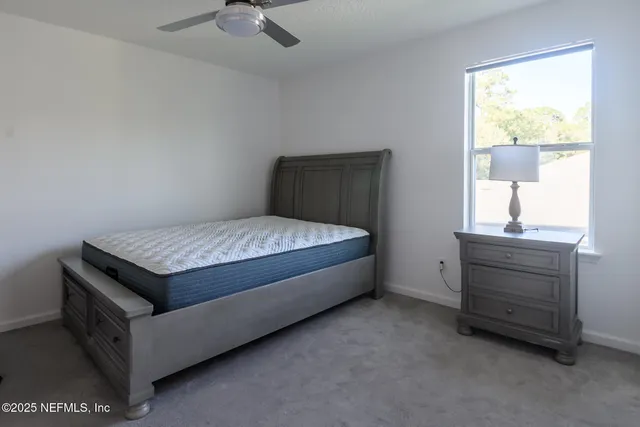 a room with a bed and a window