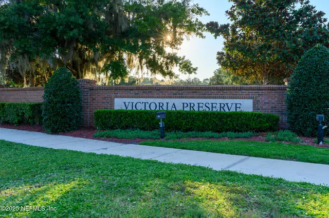 a view of a park that has a large tree