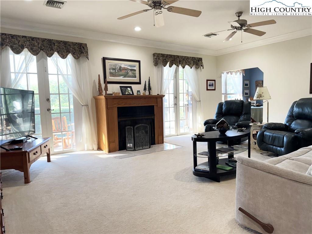175 Olive Ridge Drive Crumpler, NC 28617 - Photo 15 of 50 a living room with furniture and a fireplace