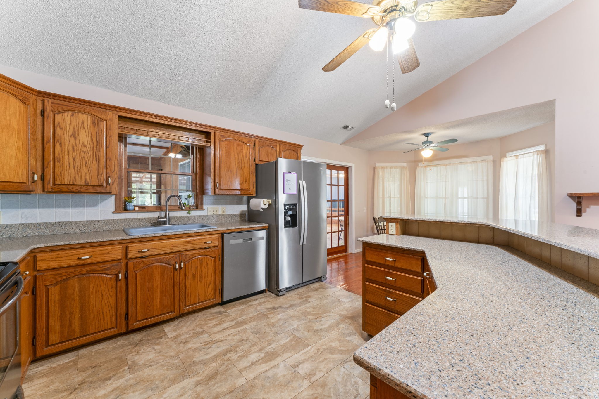 6737 Windrow Road Rockvale, TN 37153 - Photo 12 of 49 a large kitchen with stainless steel appliances granite countertop a refrigerator a oven a sink with island and windows