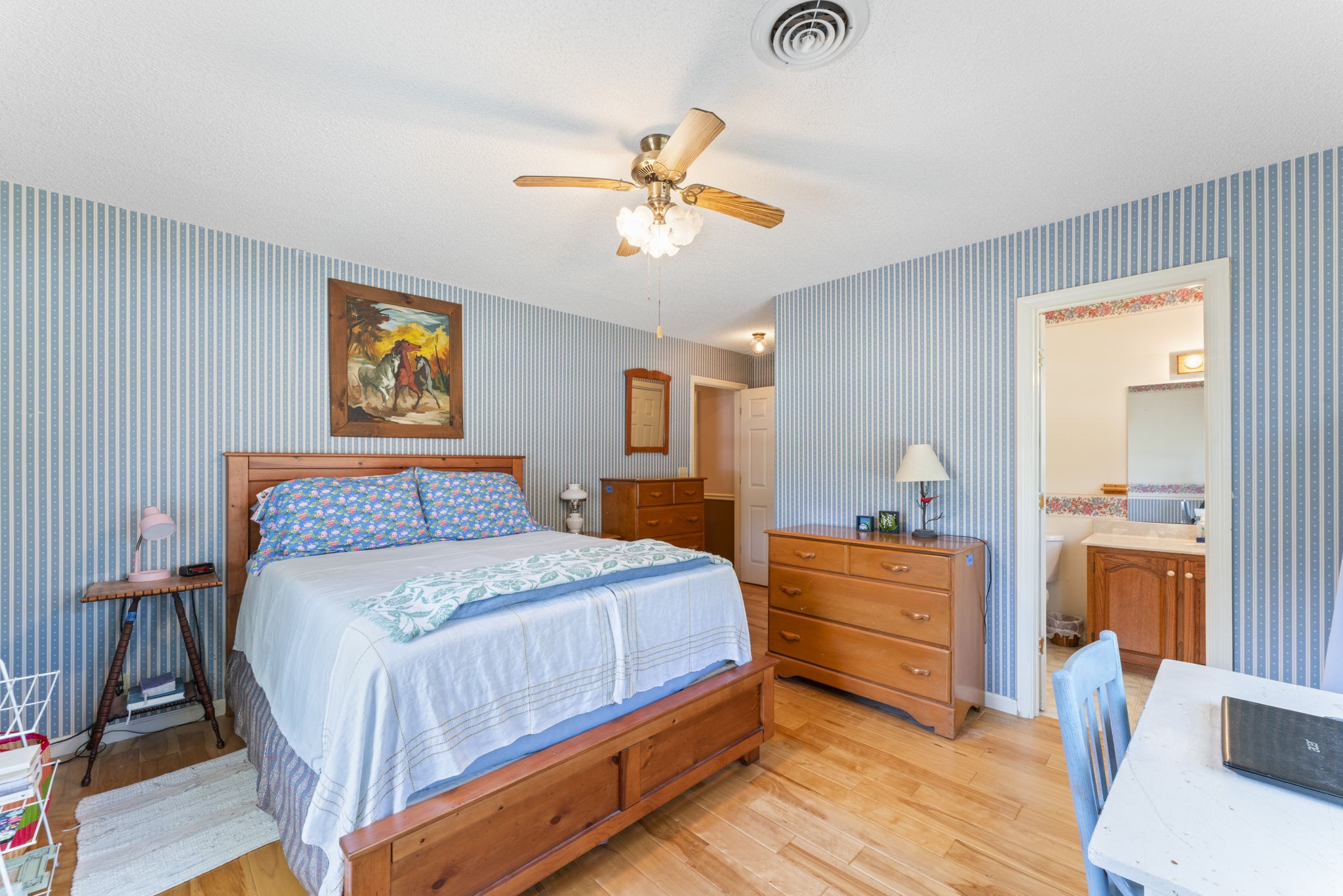 6737 Windrow Road Rockvale, TN 37153 - Photo 22 of 49 a bedroom with a bed and a chandelier