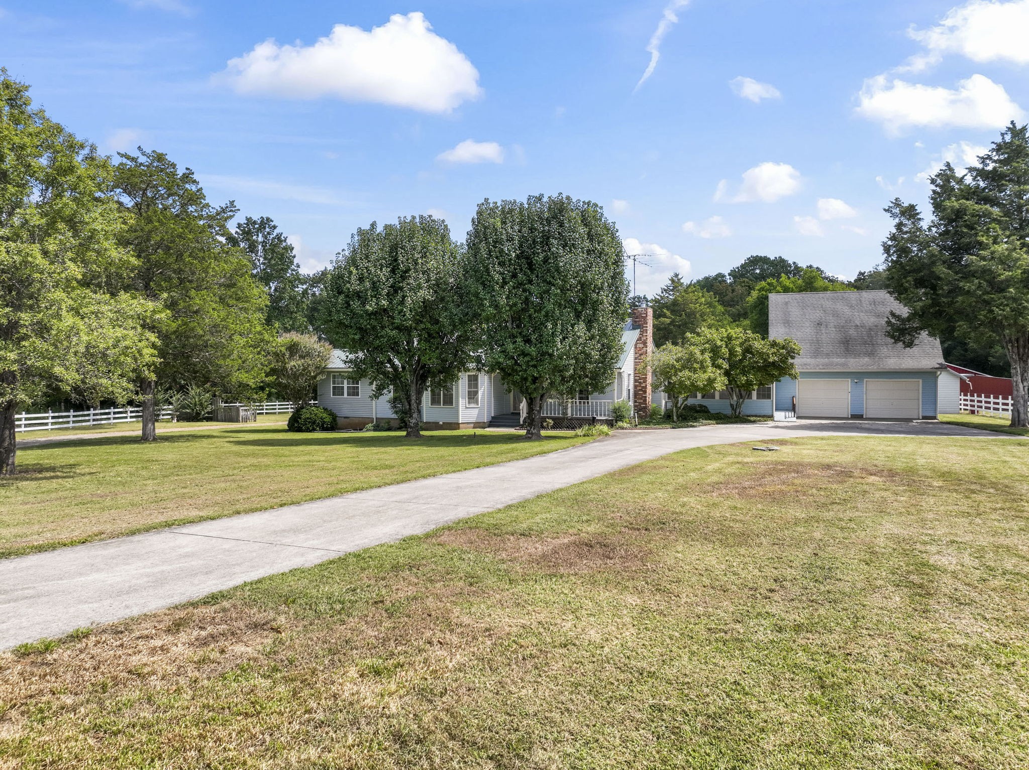 6737 Windrow Road Rockvale, TN 37153 - Photo 3 of 49 a view of a swimming pool with an outdoor seating and a garden