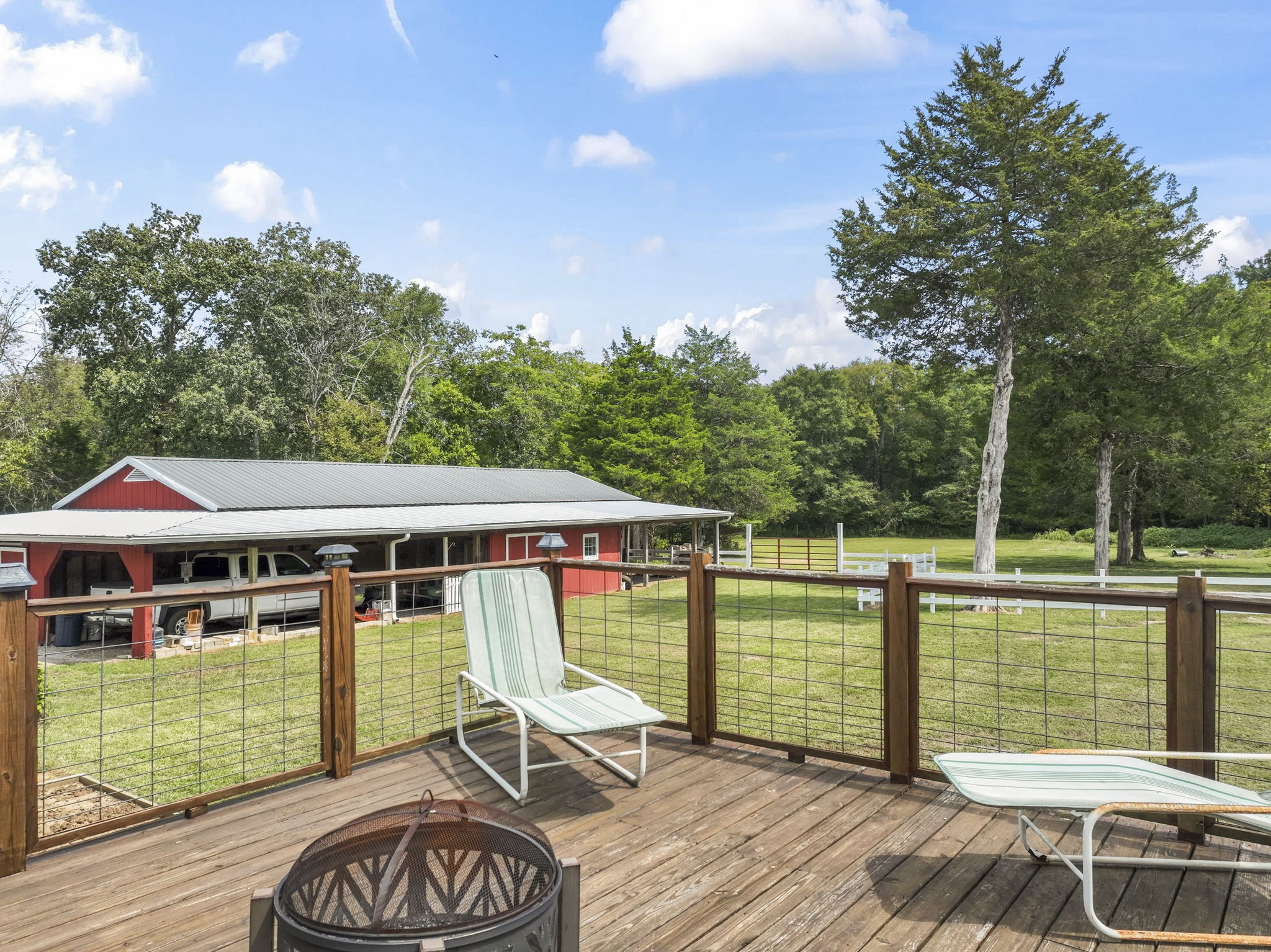 6737 Windrow Road Rockvale, TN 37153 - Photo 36 of 49 a view of a patio with a table chairs and a barbeque