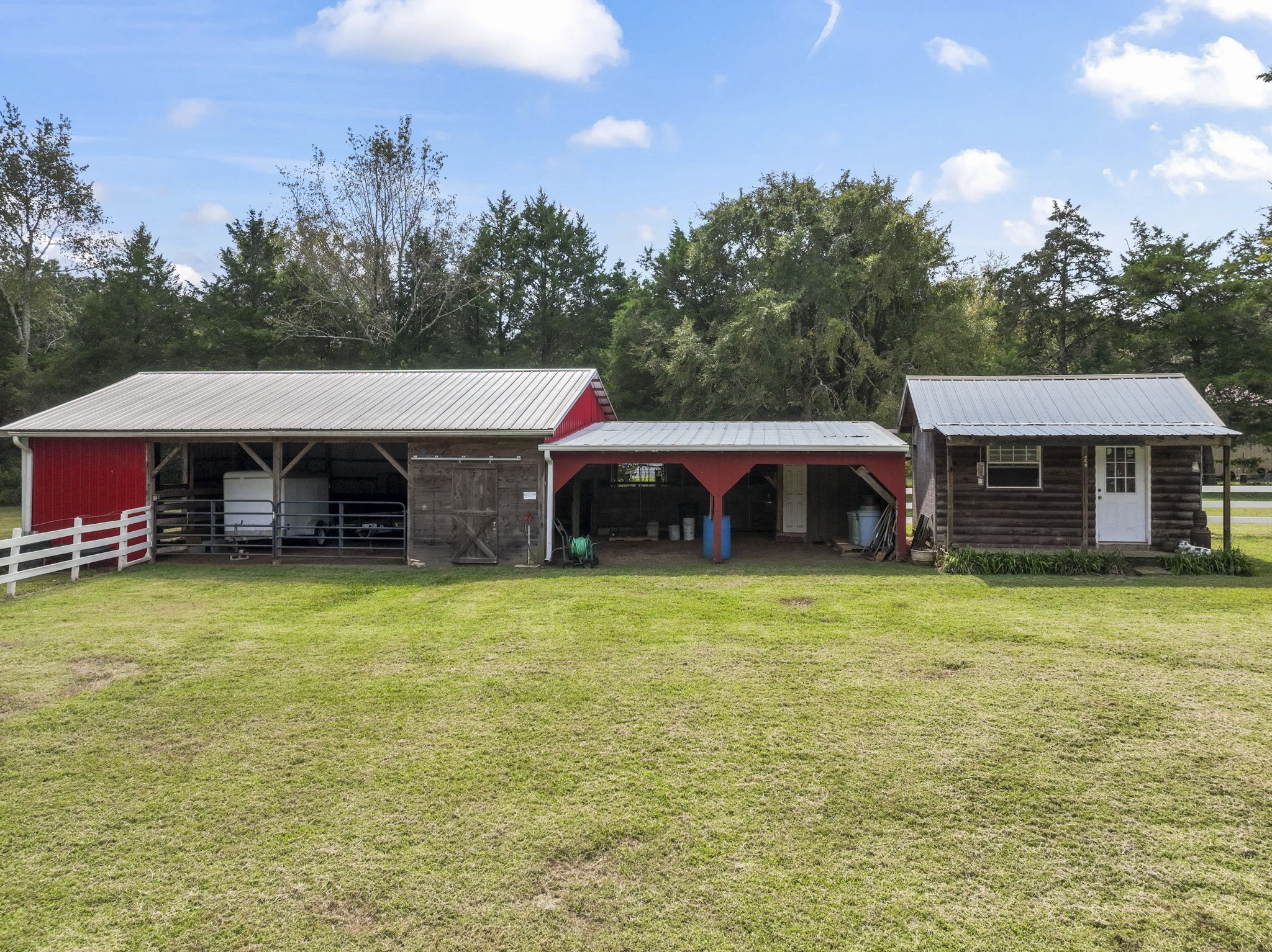 6737 Windrow Road Rockvale, TN 37153 - Photo 40 of 49 a front view of a house with a garden and deck