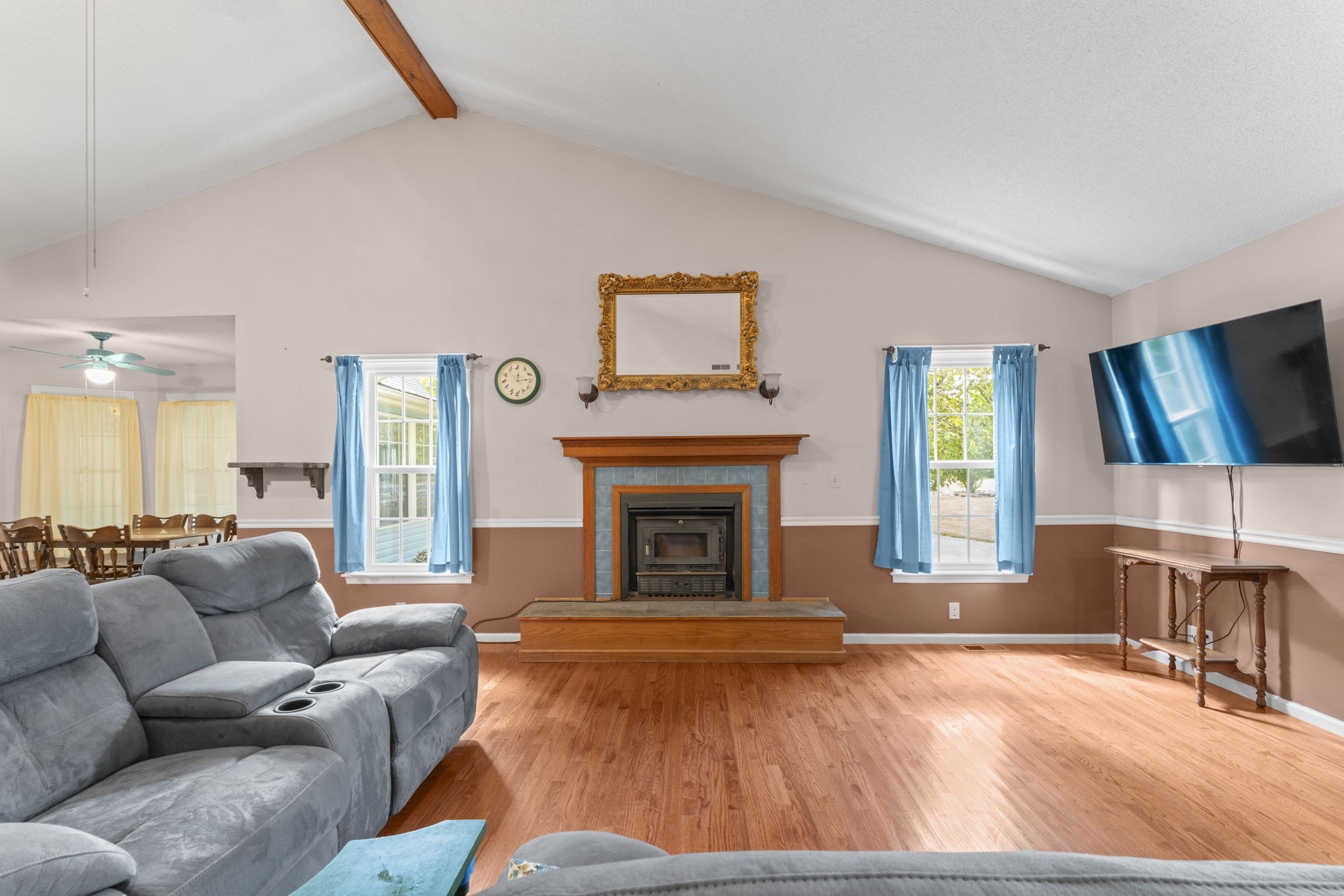 6737 Windrow Road Rockvale, TN 37153 - Photo 6 of 49 a living room with furniture a fireplace and a flat screen tv