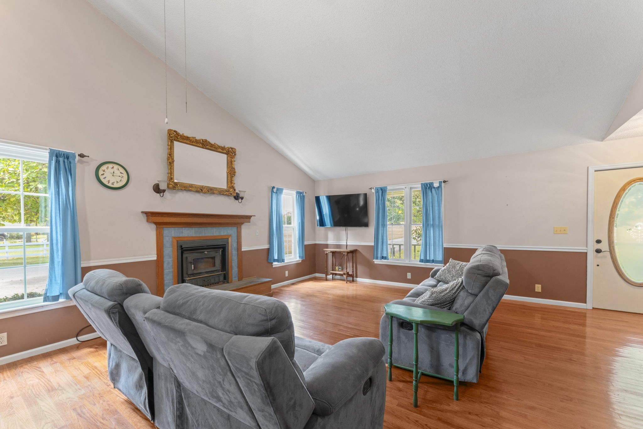 6737 Windrow Road Rockvale, TN 37153 - Photo 7 of 49 a living room with furniture a fireplace and a large window