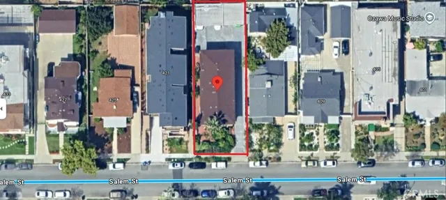 an aerial view of residential houses with city view