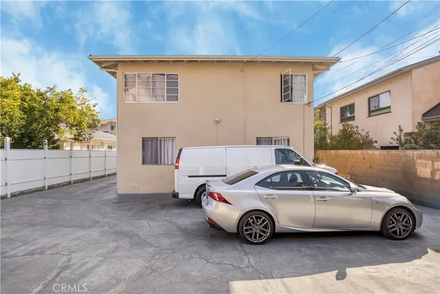 a view of a cars park in front of house