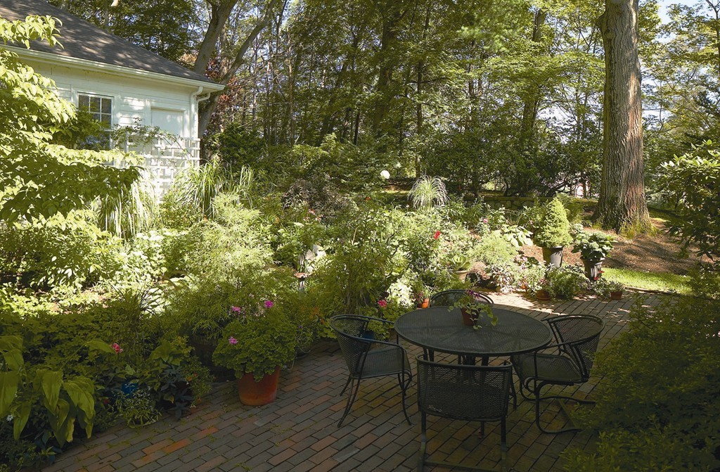 115 Windermere Road Newton, MA 02466 - Photo 8 of 8 a backyard of a house with table and chairs