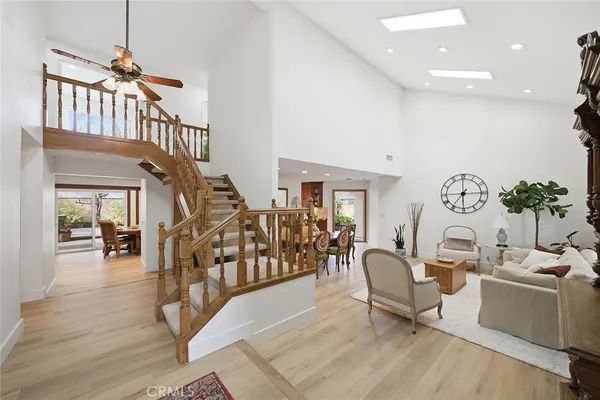 a living room with fireplace furniture and a flat screen tv
