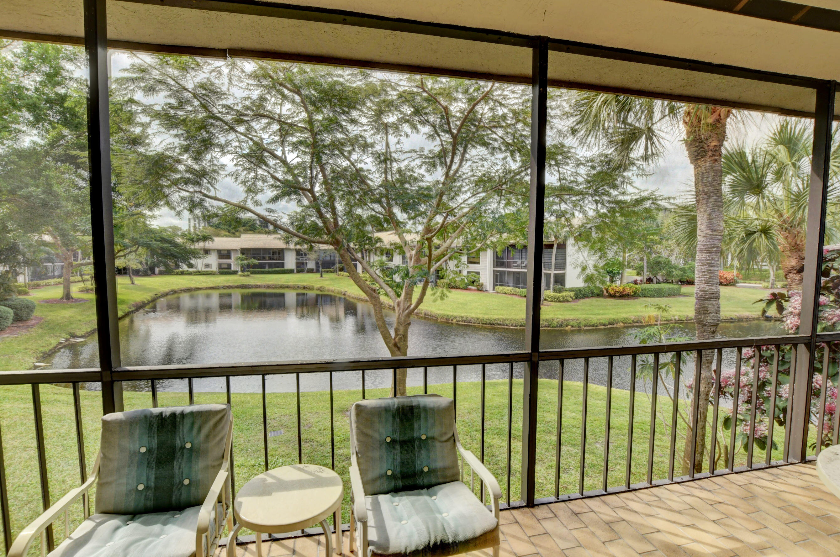 7759 Lakeside Boulevard, Unit 806 Boca Raton, FL 33434 - Photo 37 of 95 Screened balcony w/water view