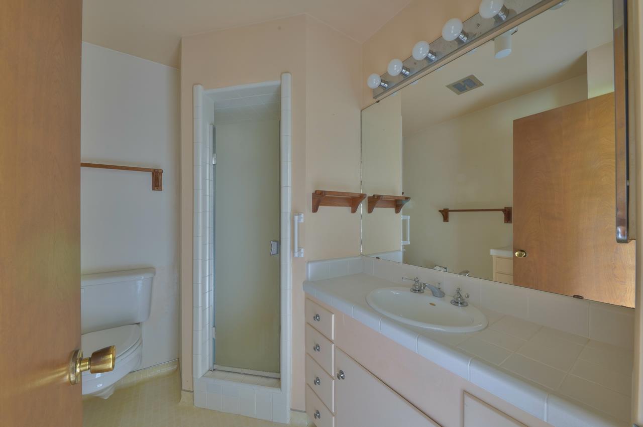 3245 Cabrillo Road Pebble Beach, CA 93953 - Photo 43 of 59 a bathroom with a granite countertop sink and a mirror