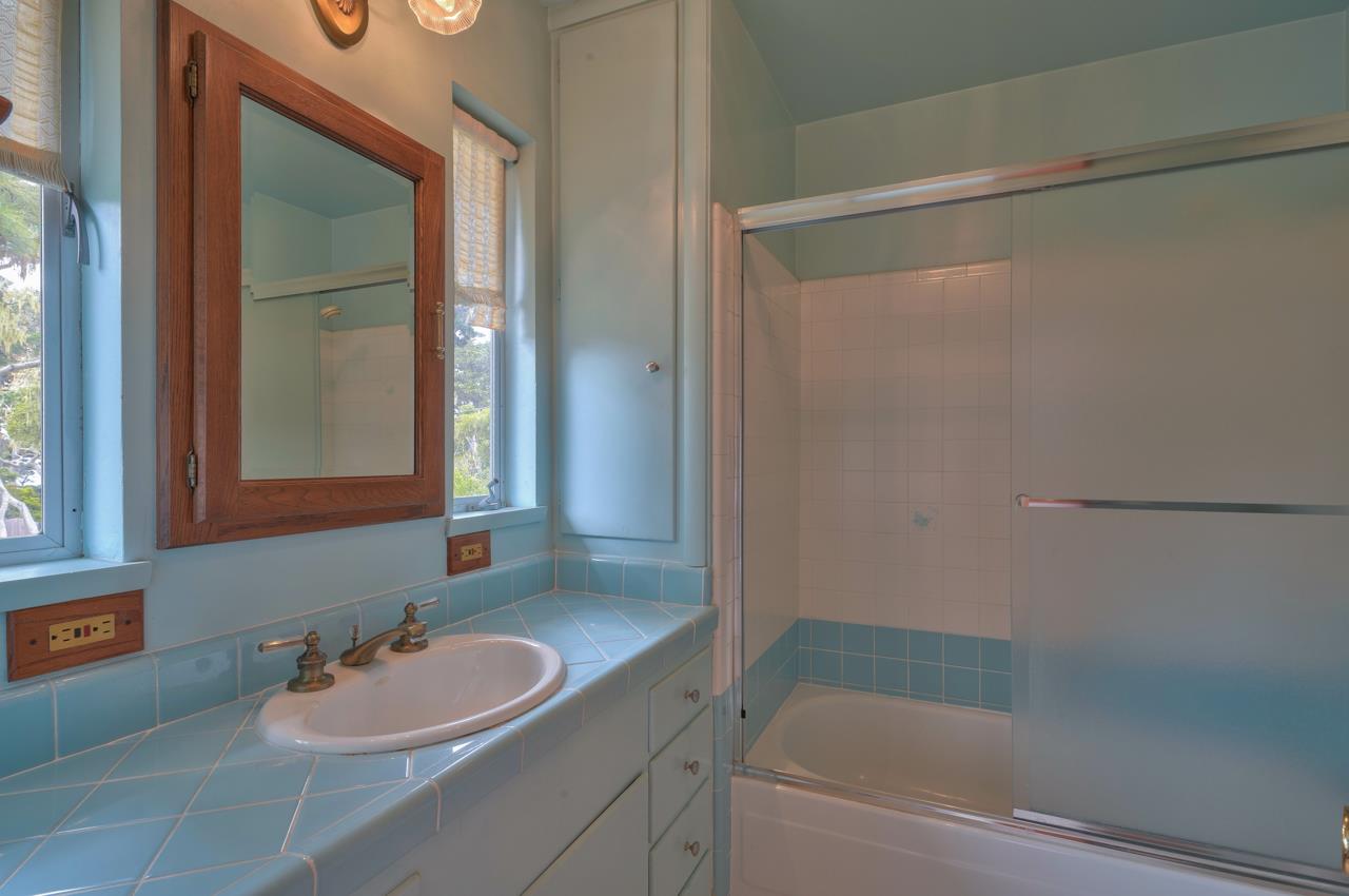 3245 Cabrillo Road Pebble Beach, CA 93953 - Photo 46 of 59 a bathroom with a sink and a mirror