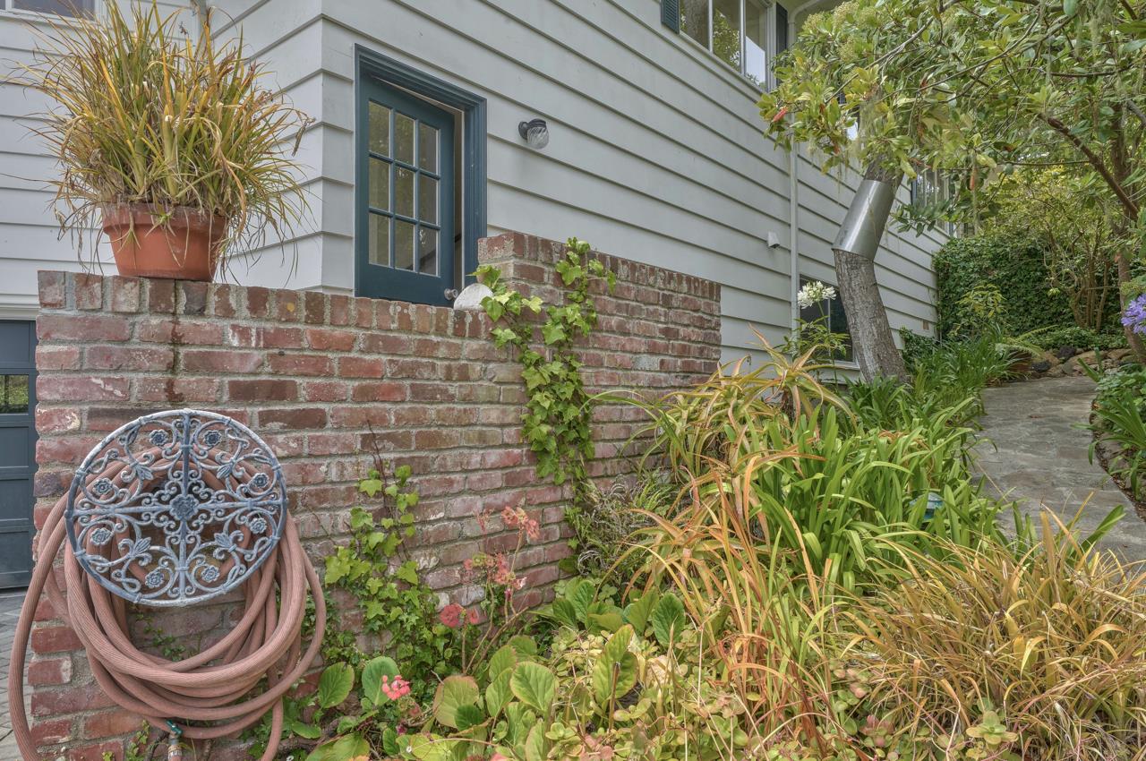 3245 Cabrillo Road Pebble Beach, CA 93953 - Photo 47 of 59 a front view of a house with garden